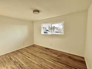 Bedroom 2 with hardwood / wood-style floors