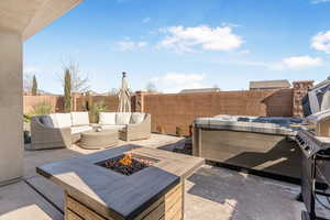 View of patio / terrace with an outdoor living space with a fire pit