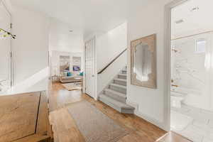 Entrance foyer featuring light hardwood / wood-style floors