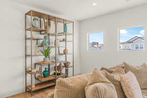 Sitting room with wood-type flooring