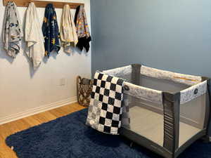 Bedroom featuring wood-type flooring