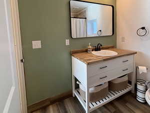 Bathroom with wood-type flooring and vanity