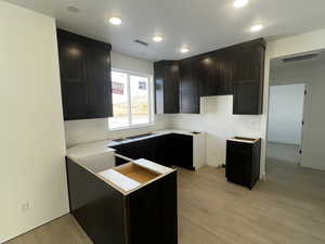 Kitchen with light wood-type flooring