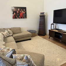 Living area featuring light wood finished floors and baseboards