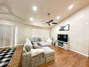 Living room.  Vaulted ceilings.  Ceiling fan.