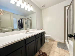 Owner's bathroom with walk-in shower and jetted tub.