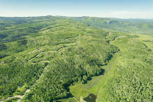 Aerial view of property's location featuring mountains