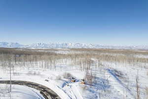 Snowy aerial view with a mountain view