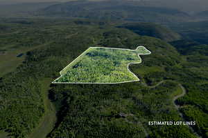 Aerial view of property's location with property boundaries highlighted and a mountainous background