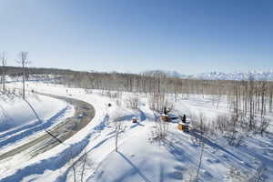 Snowy aerial view featuring a mountain view