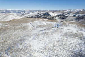 Snowy aerial view featuring a mountain view