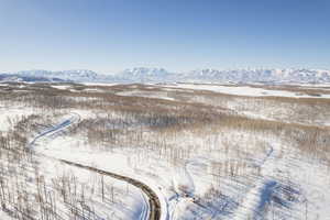 Snowy aerial view with a mountain view