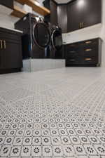 Laundry area featuring cabinets and independent washer and dryer