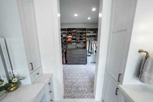 Spacious closet with carpet floors