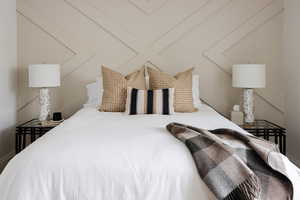Bedroom featuring vaulted ceiling