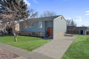 Freshly painted exterior and door, Virtually staged lawn