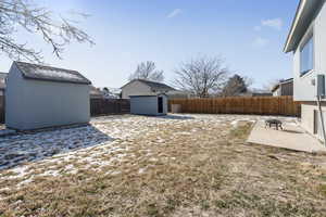 View of large yard and patio