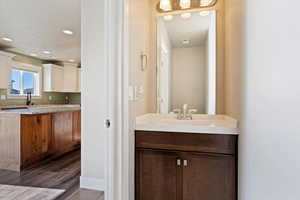 Bathroom featuring vanity and hardwood / wood-style flooring