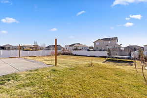 View of yard featuring a patio area and a trampoline