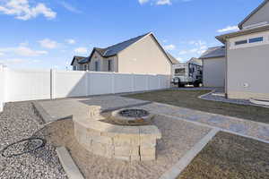 View of patio featuring an outdoor fire pit