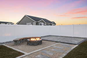 Yard at dusk with an outdoor fire pit