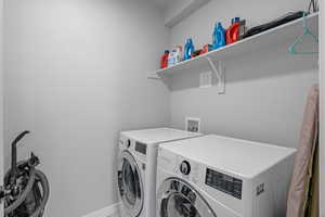 Laundry area featuring washing machine and clothes dryer