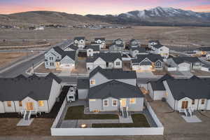 Aerial view at dusk featuring a mountain view