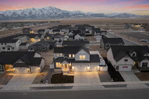 Aerial view at dusk featuring a mountain view