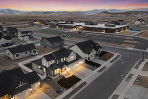 Aerial view at dusk featuring a mountain view