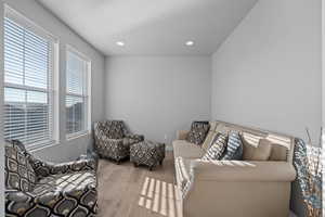 Sitting room featuring light hardwood / wood-style floors