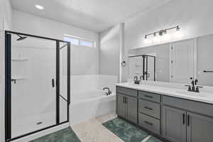 Bathroom with plus walk in shower and vanity