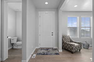 Entrance foyer featuring light hardwood / wood-style floors
