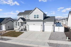 View of front of house with a garage and a mountain view