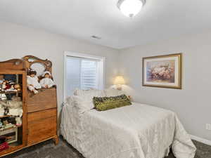 Bedroom featuring carpet flooring