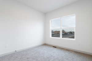 View of carpeted spare room