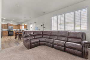 Family room featuring light colored carpet