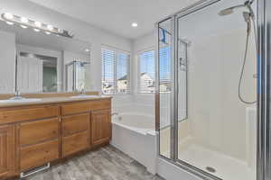 Primary bathroom with separate walk-in shower and soaker tub