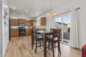 Dining area featuring light LVP flooring