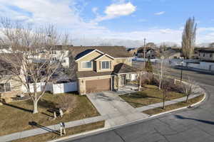 View of front property featuring a mountain view and a garage