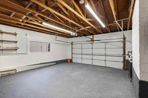 Garage featuring a garage door opener