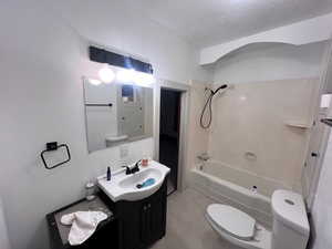 Full bathroom featuring shower / bathtub combination, toilet, and vanity