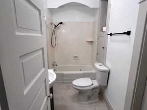 Full bathroom featuring toilet, vanity, and  shower combination