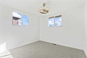 Empty room with carpet floors
