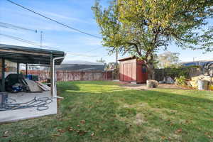 View of yard featuring a storage shed