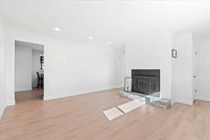 Unfurnished living room with light hardwood / wood-style flooring