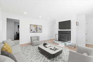 Living room with light hardwood / wood-style floors