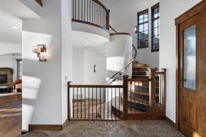 Staircase featuring a wealth of natural light