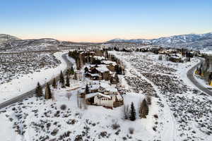 Snowy aerial view featuring a mountain view