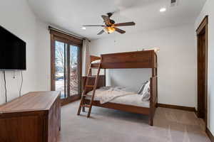 Bedroom featuring ceiling fan, light colored carpet, and access to outside