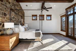 Carpeted bedroom featuring ceiling fan, beamed ceiling, and high vaulted ceiling